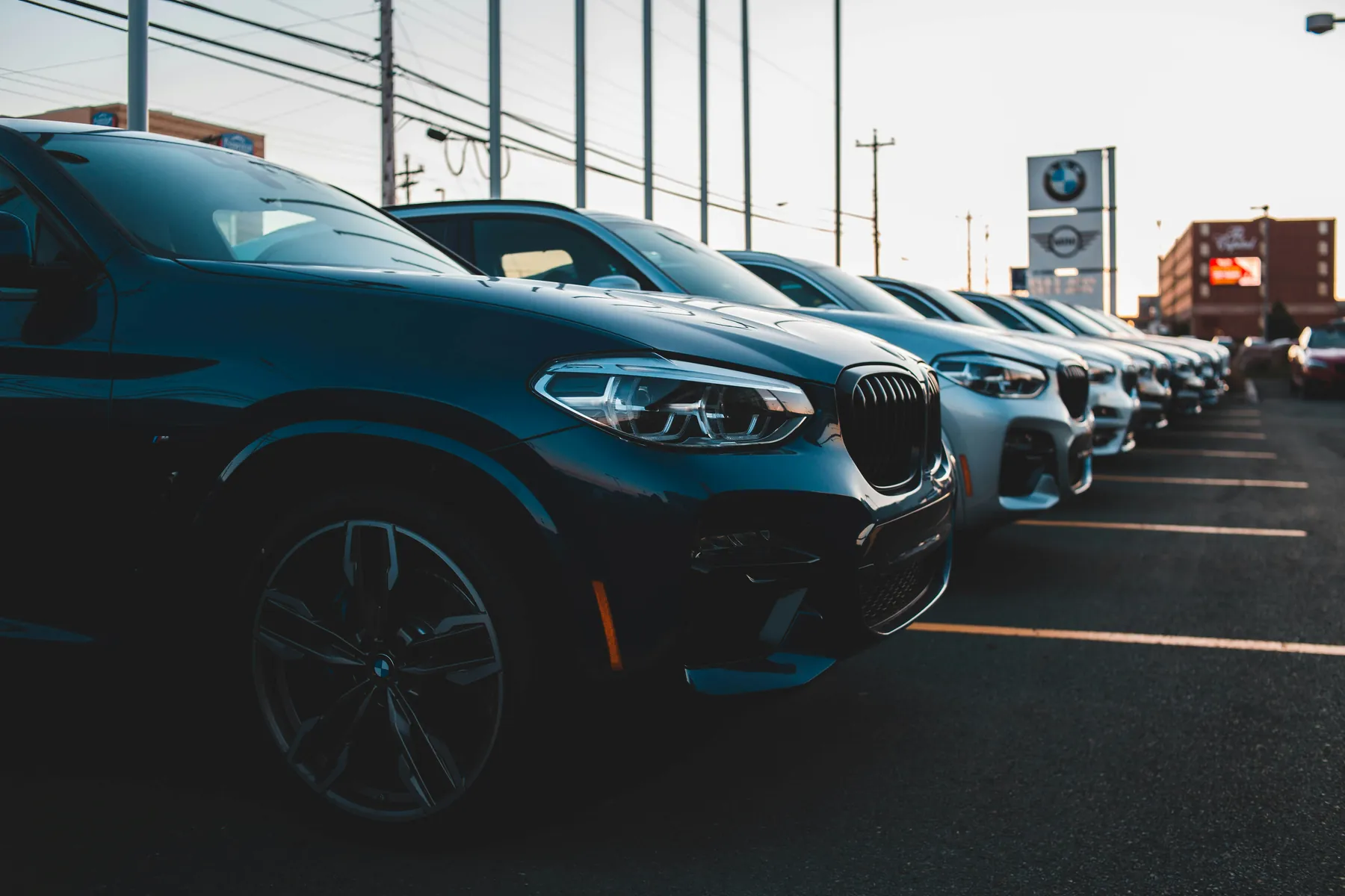 Row of new cars at a dealership