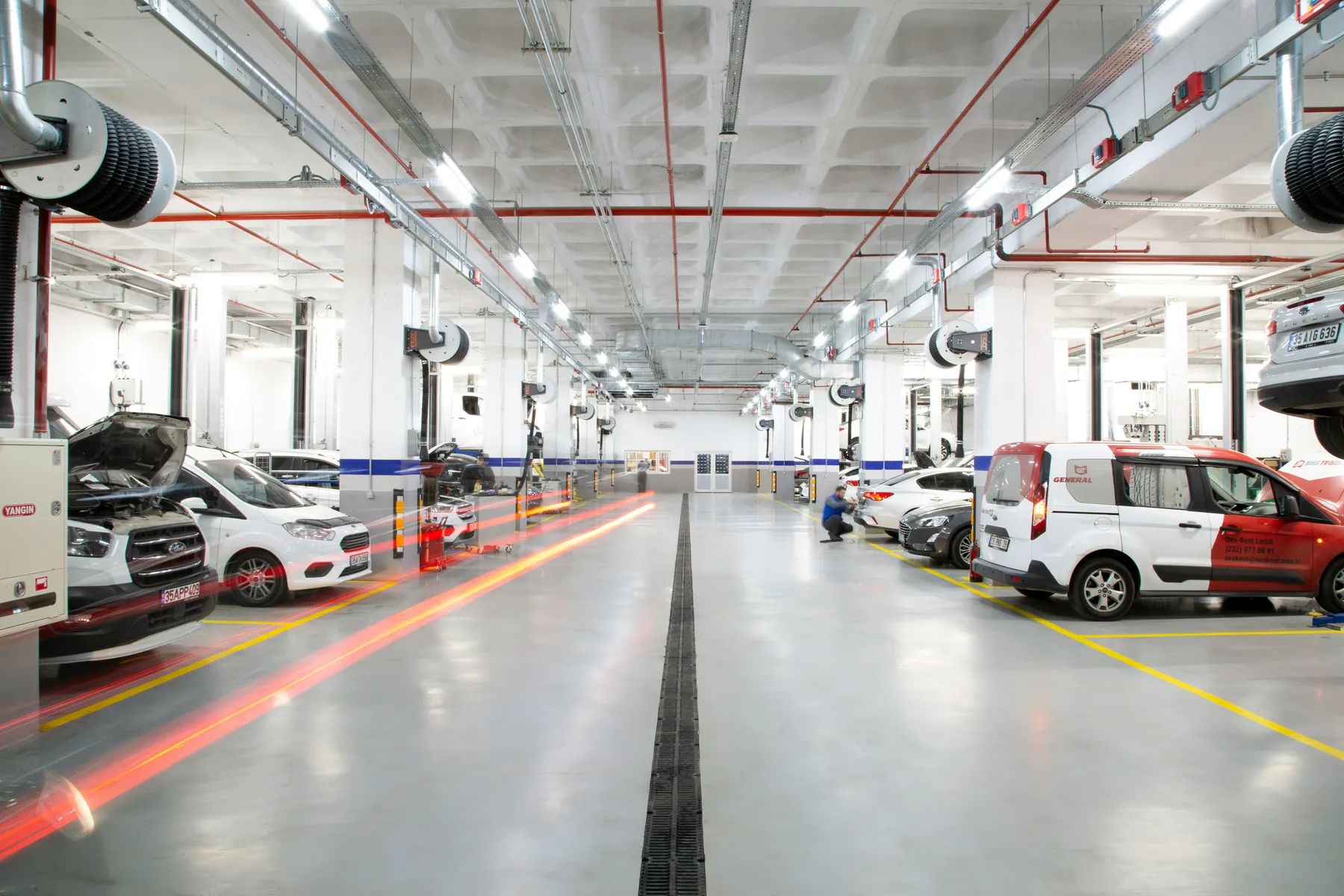 Professional vehicle inspection workshop with multiple service bays