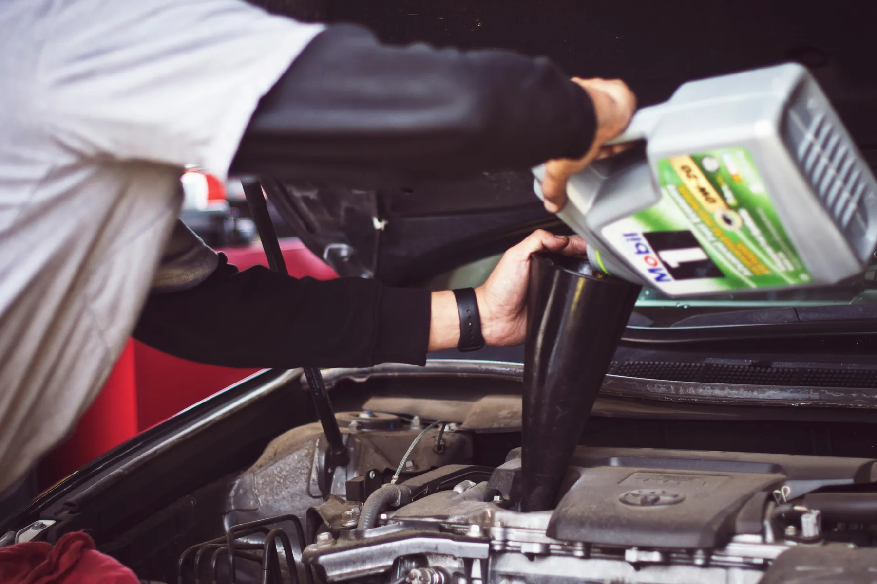 Engine fluid being added during vehicle service