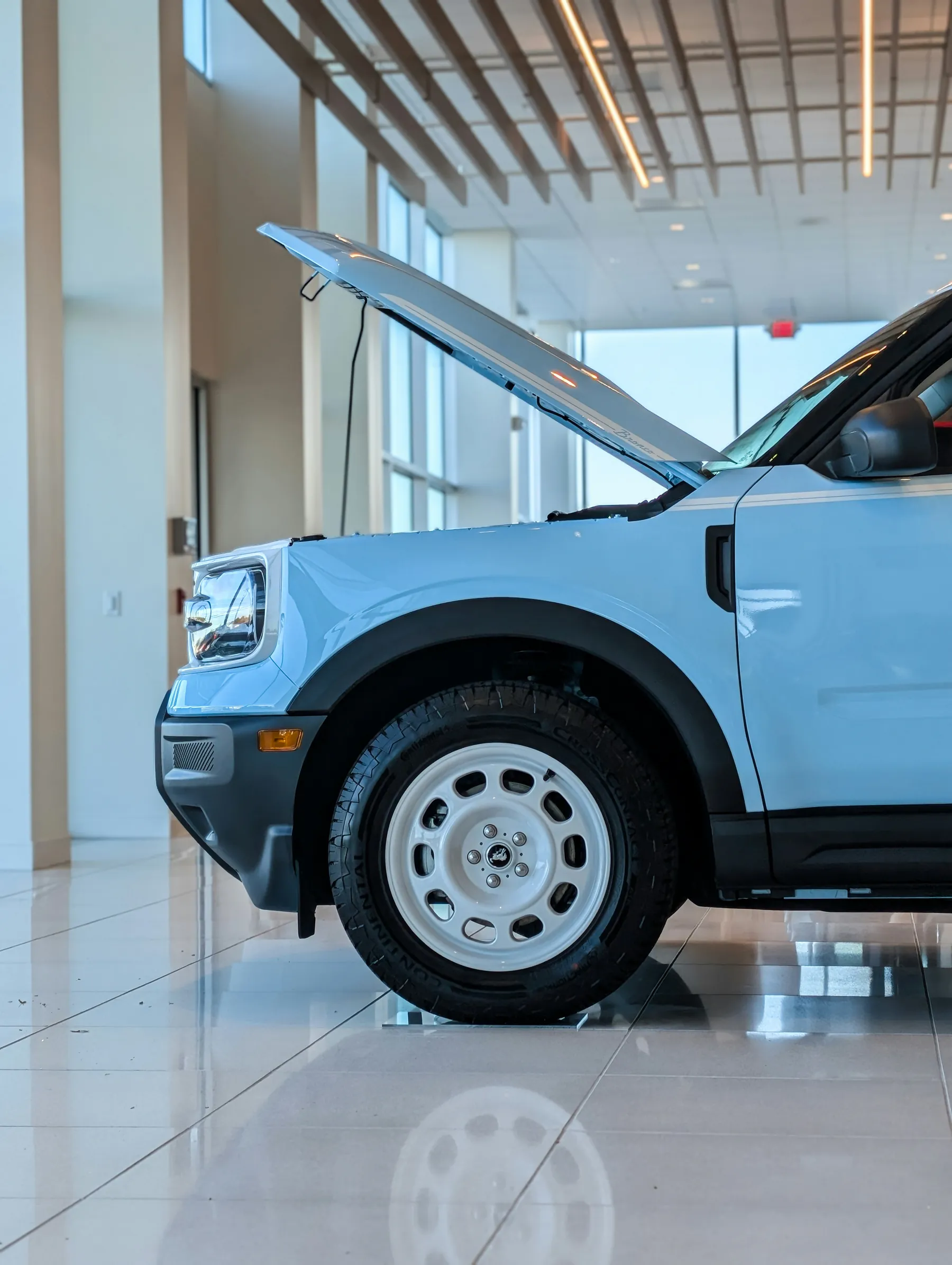 New vehicle displayed inside a bright car showroom