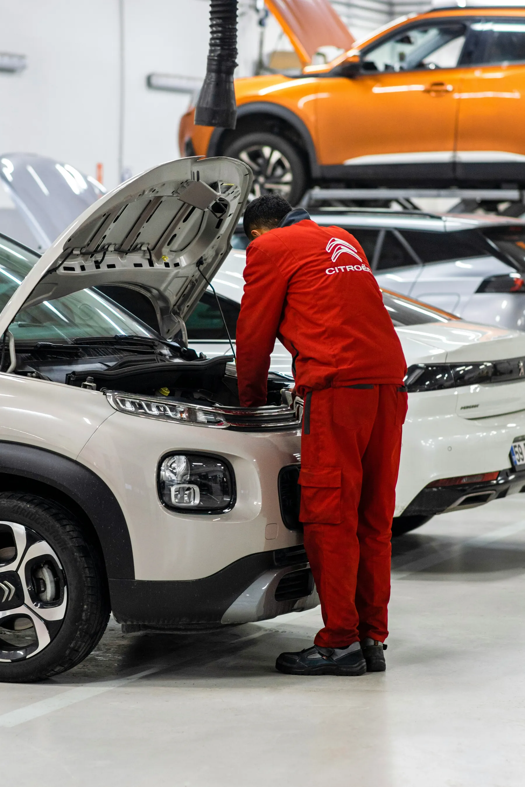 Close inspection of a vehicle engine with checklist
